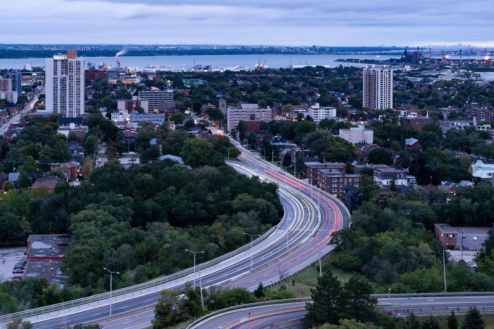 an aerial view of a city with a highway going through it